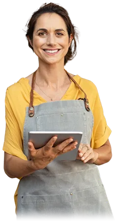 Small business owner smiling while holding a tablet
